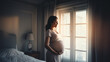 maternity photo with young pregnant Hispanic woman holding her enlarged belly in bedroom in front of bright window