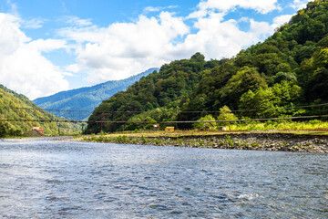 Wall Mural - travel to georgia - machakhelistsqali river with suspension bridge in mountain in adjara on sunny au