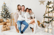 Photoshooting of family members in photo studio for Christmas and New Year