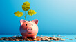 Eco-friendly savings concept with a pink piggy bank and growing green plant sprout on top with scattered coins on a blue background