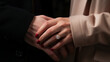 © Vika art - Cropped view of woman in ring on finger holding man hand.