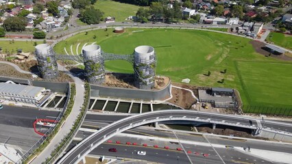 Wall Mural - Aerial drone pullback reverse view of Rozelle Interchange in Sydney, NSW Australia from above the large chimney towers, shot on 3 December 2023 