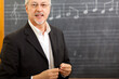 © Minerva Studio - Experienced music teacher in classroom