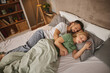 © Stockphotodirectors - Couple sleeping embraced in bed