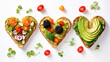 Festive delicious toasts with vegetables, heart-shaped, on a white background