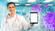 © Grispb - Man doctor with tablet computer. Virologist smiles while standing in clinic. Gadget with blank screen. Virus molecules near doctor. Man virologist in white coat. Medical template. Healtcare mock up