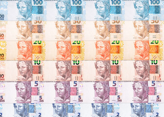 Wall Mural - texture or background with Brazilian money banknotes, 100, 50, 20, 10 5 and 2 reais. Brazilian currency paper