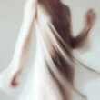 © dizfoto1973 - Dancing women in white dresses. The photo is motion blurred.
