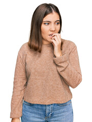 Sticker - Young beautiful woman wearing casual clothes looking stressed and nervous with hands on mouth biting nails. anxiety problem.