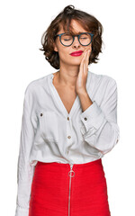 Canvas Print - Young hispanic woman wearing business style and glasses touching mouth with hand with painful expression because of toothache or dental illness on teeth. dentist