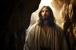 Jesus Christ in robe stands at a cave entrance. Concept of enlightenment or revelation