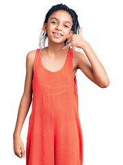 Poster - Cute african american girl wearing casual clothes smiling doing phone gesture with hand and fingers like talking on the telephone. communicating concepts.