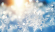 A snowflake on a blue background with a gradient of blue blurred bokeh. Dreamy and wintery mood. Winter, xmas background.