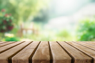 Wall Mural - Wooden table or surface with blurred summer forest background