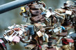 Many lockers tied together in a love bridge close up still in Riga, Latvia