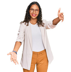 Poster - Young african american girl wearing business clothes looking at the camera smiling with open arms for hug. cheerful expression embracing happiness.