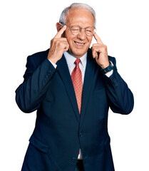 Canvas Print - Senior man with grey hair wearing business suit and glasses covering ears with fingers with annoyed expression for the noise of loud music. deaf concept.