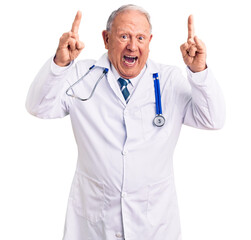 Canvas Print - Senior handsome grey-haired man wearing doctor coat and stethoscope shouting with crazy expression doing rock symbol with hands up. music star. heavy music concept.