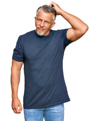 Poster - Middle age grey-haired man wearing casual clothes confuse and wonder about question. uncertain with doubt, thinking with hand on head. pensive concept.