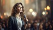 © jp - Jeune femme avec micro en pleine conférence ou séminaire