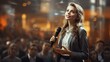 © jp - Jeune femme avec micro en pleine conférence ou séminaire