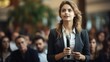 © jp - Jeune femme avec micro en pleine conférence ou séminaire