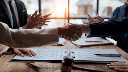 Wall Mural - Businessman handshake to seal a deal with his partner lawyers or attorneys discussing a contract agreement.