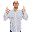 © Krakenimages.com - Bald man with beard wearing business shirt and glasses relax and smiling with eyes closed doing meditation gesture with fingers. yoga concept.