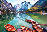 Fototapeta Natura - Magical autumn landscape with boats on the lake on Fanes-Sennes-Braies in the Dolomites Alps, Italy. (mental vacation, holiday, inner peace, harmony - concept)