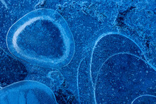 Top view of blue Bubbles under frozen water surface