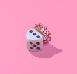 Wall Mural - Creative layout with dice and golden crown. Bright pink background with shadow. Winner, Gambling concept. Visual trend. Minimalistic aesthetic still life. Fresh idea