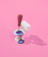 Wall Mural - Creative layout of toilet bowl with slime and witch hat on bright pink background. Visual trend. Halloween concept. Minimalistic aesthetic still life with shadow. Fresh idea