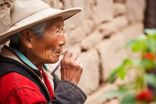 Elderly Asian Man Smoking Pipe Peacefully. Generative AI