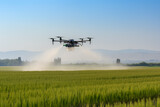 Fototapeta  - Drone sprayer flies over the agricultural field. Smart farming and precision agriculture	