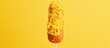 Mustard-covered fried sausage on a homemade corn dog stick.