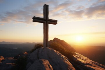 Wall Mural - A cross standing tall on top of a mountain, illuminated by the warm colors of a beautiful sunset. Perfect for religious themes and inspirational concepts
