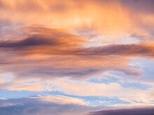 Sweeping Orange Sunset Skies With Soft Cloud Patterns
