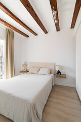 Wall Mural - Bed with nightstands and wooden beams in attic bedroom