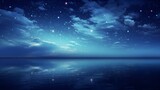Fototapeta Morze - the moon reflecting over water in the night sky