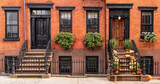 Fototapeta  - Typical Greenwich Village houses in New York with entrance staircase and wooden doors