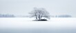 Minimalistic winter landscape of a leafless island amidst snow-covered lake.