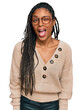 © Krakenimages.com - African american woman wearing casual clothes winking looking at the camera with sexy expression, cheerful and happy face.