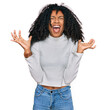 © Krakenimages.com - Young african american girl wearing casual clothes crazy and mad shouting and yelling with aggressive expression and arms raised. frustration concept.