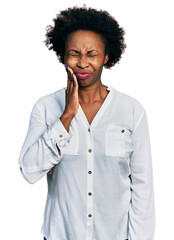 Poster - African american woman with afro hair wearing casual white t shirt touching mouth with hand with painful expression because of toothache or dental illness on teeth. dentist