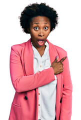 Poster - African american woman with afro hair wearing business jacket surprised pointing with finger to the side, open mouth amazed expression.