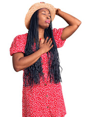 Canvas Print - Young african american woman wearing summer hat touching forehead for illness and fever, flu and cold, virus sick