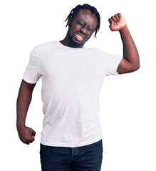 Sticker - Young african american man with braids wearing casual white tshirt stretching back, tired and relaxed, sleepy and yawning for early morning