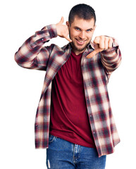 Sticker - Young handsome man wearing casual shirt smiling doing talking on the telephone gesture and pointing to you. call me.