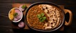 Valentine's day breakfast: Heart-shaped Indian flat bread served with dal makhani in a tray, seen from above.