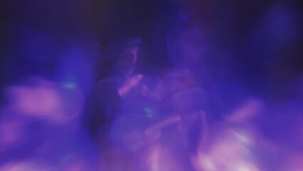 Wall Mural - Defocused fluorescent blue purple color bokeh on dark black abstract background